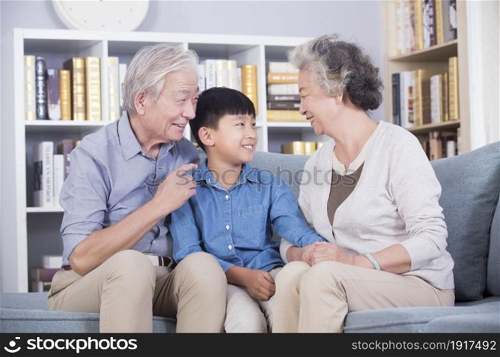 Happy grandparents and their grandchild