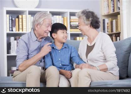 Happy grandparents and their grandchild