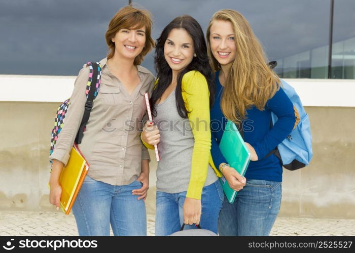 Happy group of beautiful female students in the school