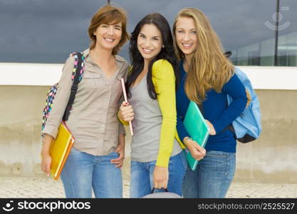 Happy group of beautiful female students in the school