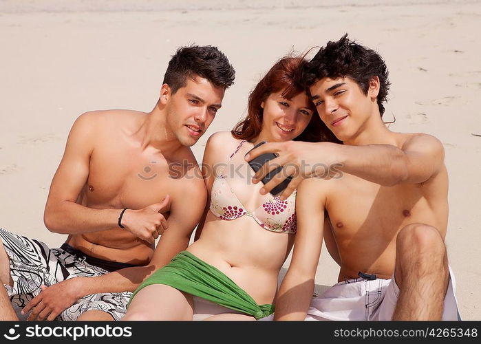 Happy group of friends at the beach