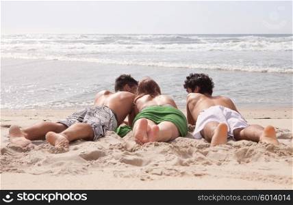 Happy group of friends at the beach