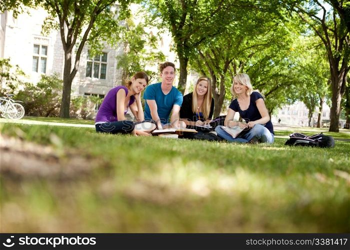 Happy group of university students looking at the camera