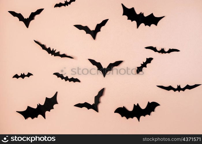 Happy Halloween. Bats on a pink pastel background. Place for text.. Happy Halloween. Bats on pink pastel background.