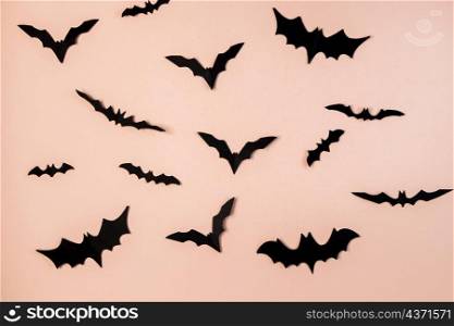 Happy Halloween. Bats on a pink pastel background. Place for text.. Happy Halloween. Bats on pink pastel background.