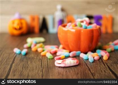 Happy Halloween day with ghost candies, pumpkin bowl, Jack O lantern and decorative  selective focus . Trick or Threat, Hello October, fall autumn, Festive, party and holiday concept