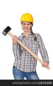 Happy handywoman holding a hammer