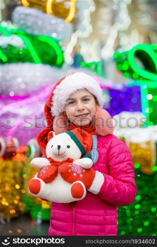 Happy happy laughing child girl with christmas present. Christmas concept. Gifts from Santa.. Happy happy laughing child girl with christmas present. Christmas concept.