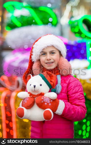 Happy happy laughing child girl with christmas present. Christmas concept. Gifts from Santa.. Happy happy laughing child girl with christmas present. Christmas concept.