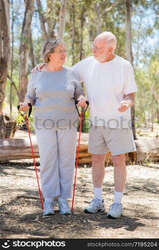 Happy Healthy Senior Couple Exercising Outside Together.