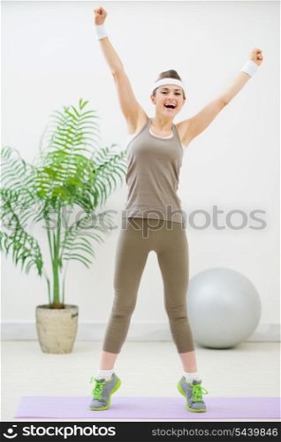Happy healthy woman making gymnastics