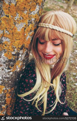 Happy hippie young woman in an autumn day
