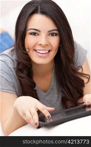 Happy Hispanic Woman Using Tablet Computer or iPad
