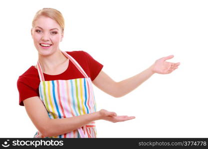 Happy housewife kitchen apron or small business owner entrepreneur shop assistant waitress making inviting welcome gesture pointing copy space isolated on white