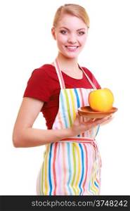 Happy housewife or chef in colorful kitchen offering red yellow apple healthy fruit isolated studio shot. Diet and nutrition.
