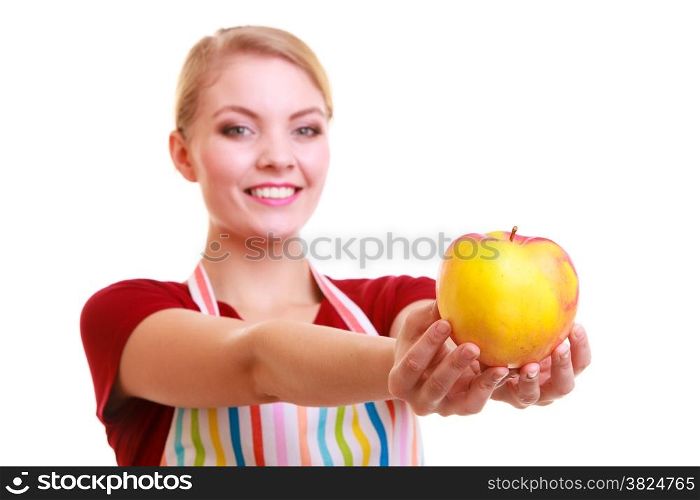 Happy housewife or chef in colorful kitchen showing red yellow apple healthy fruit isolated studio shot. Diet and nutrition.