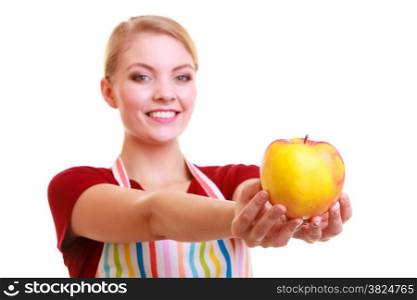 Happy housewife or chef in colorful kitchen showing red yellow apple healthy fruit isolated studio shot. Diet and nutrition.