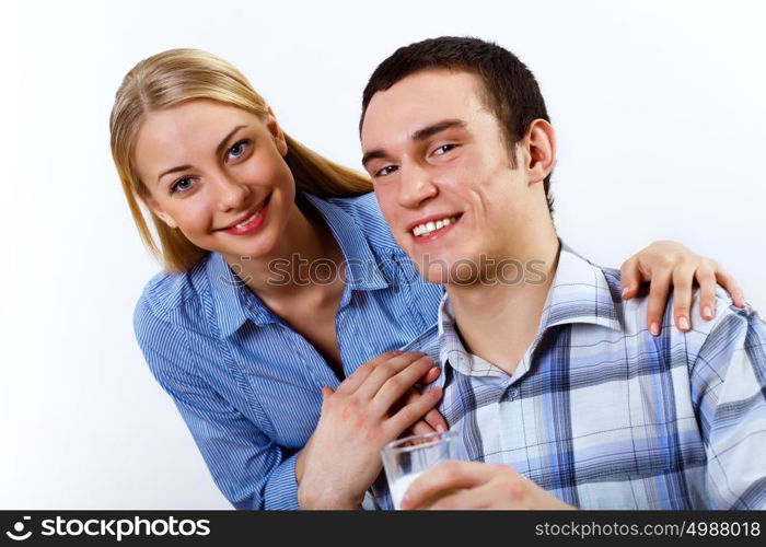 Happy husband and wife cooking together at home