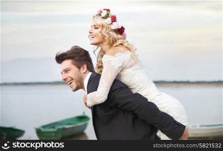 Happy husband carrying his lovely wife