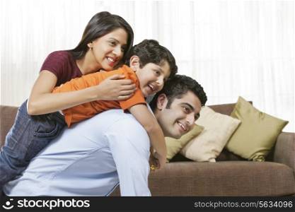 Happy Indian family of three at home