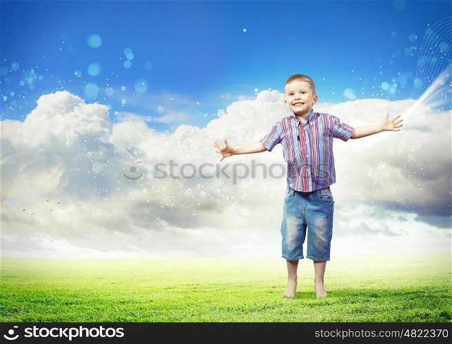happy kid jumping. Photo of little boy jumping and raising hands