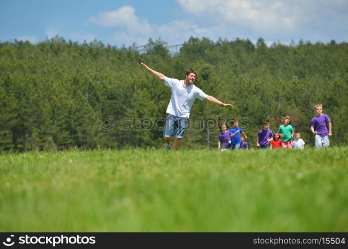 happy kids group have fun in nature outdoors park