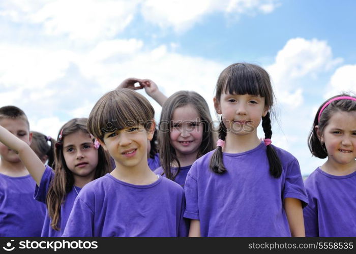 happy kids group have fun in nature outdoors park