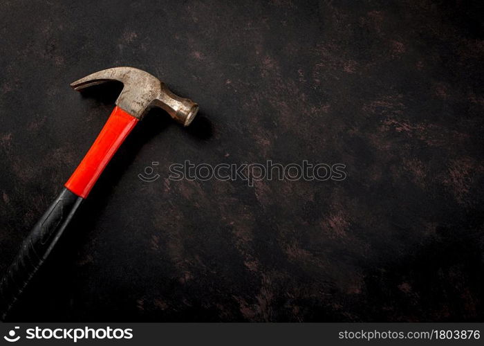 Happy Labor day. Metal hammer constructor work tools with copy space on black dark background