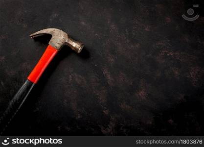 Happy Labor day. Metal hammer constructor work tools with copy space on black dark background