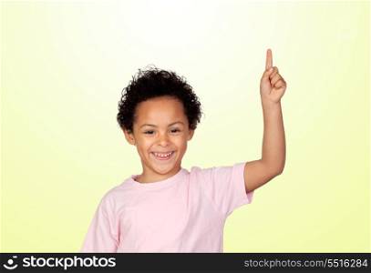 Happy latin child asking to speak isolated on yellow background