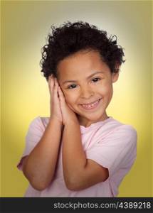 Happy latin child making the gesture of sleep with a yellow background