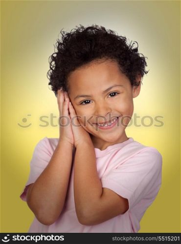 Happy latin child making the gesture of sleep with a yellow background
