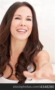 Happy Laughing Beautiful Brunette Woman Reaching Out