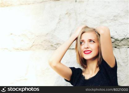 Happy laughing young emotional woman with short hair in fashion blouse. Vintage closeup portrait. Portrait of a beautiful blond fashion model with red lips. Valentine&rsquo;s Day.