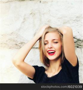 Happy laughing young emotional woman with short hair in fashion blouse. Vintage closeup portrait. Portrait of a beautiful blond fashion model with red lips. Valentine&rsquo;s Day.