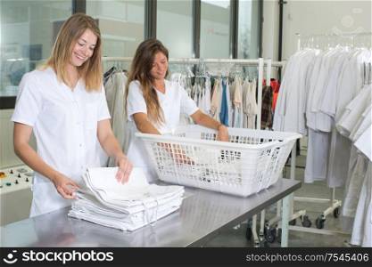 happy laundry workers at the dry cleaners