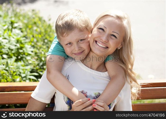 Happy Little boy and mother in summer day