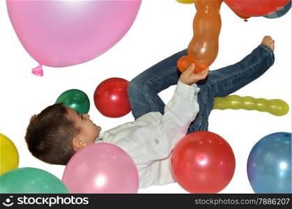 Happy little boy playing with colorful balloons