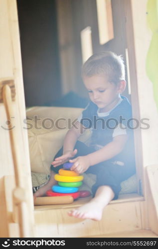 happy little child play game and have fun, education lessons in colorful kinder garden playground indoors