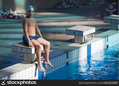 happy little child portrait on swimming school classes and recreation at indoor pool