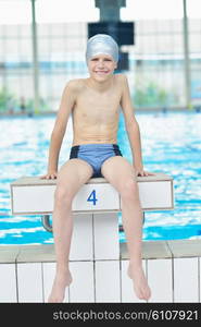 happy little child portrait on swimming school classes and recreation at indoor pool