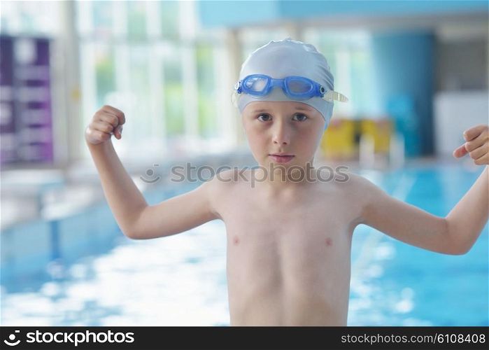 happy little child portrait on swimming school classes and recreation at indoor pool