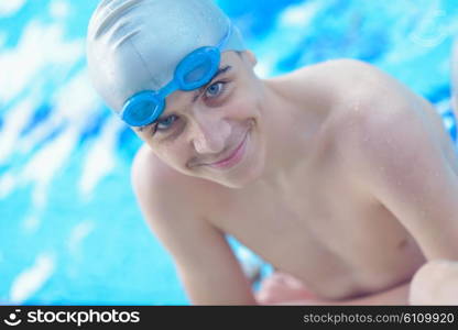 happy little child portrait on swimming school classes and recreation at indoor pool