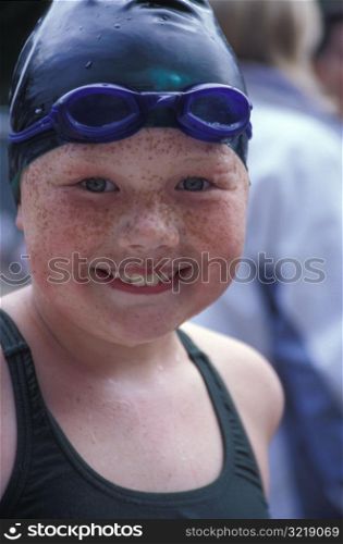 Happy Little Freckled Girl Wearing Swimming Cap