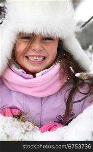 Happy little girl at ski resort