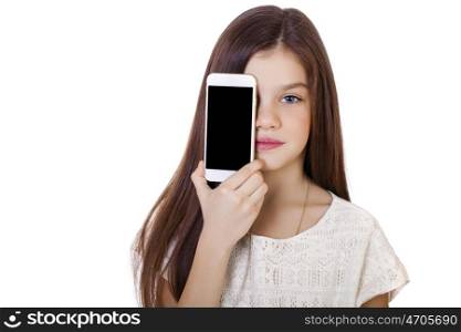 Happy little girl covers her face screen smartphone on white isolated background