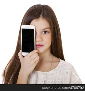 Happy little girl covers her face screen smartphone on white isolated background