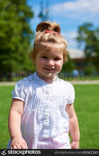 happy little girl have fun in park