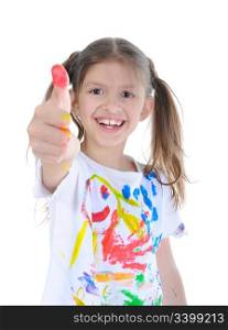 Happy little girl in a paint shows a thumb upwards. Isolated on white background.