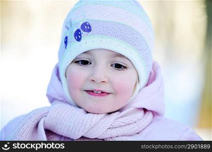 Happy little girl in winter. portrait